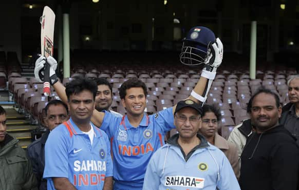 Indian cricket fans stand behind a wax statue of Sachin Tendulkar at the SCG in Sydney.