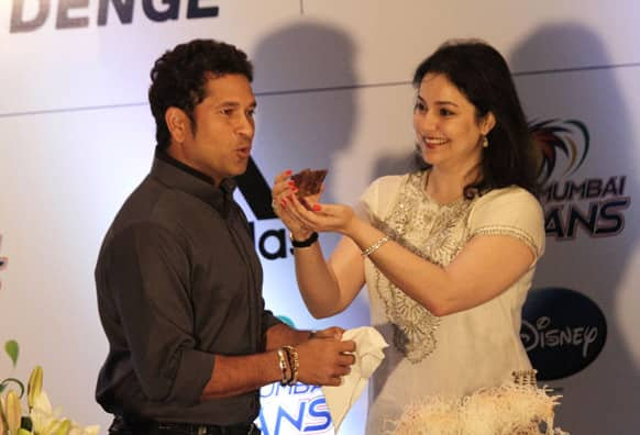 Anjali Tendulkar, wife of Sachin Tendulkar, offers him a piece of cake during celebration of his 40th birthday in Kolkata.