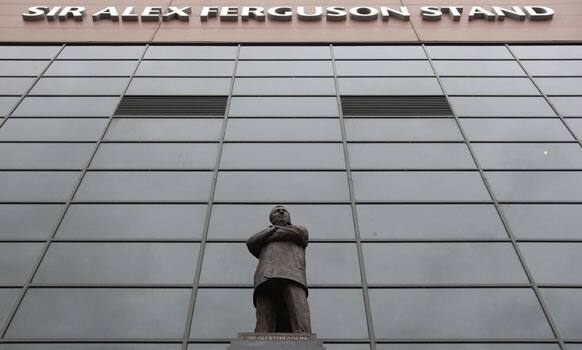 A file photo a bronze statue by sculptor Philip Jackson of Manchester United's manager Sir Alex Ferguson stands outside the Sir Alex Ferguson Stand