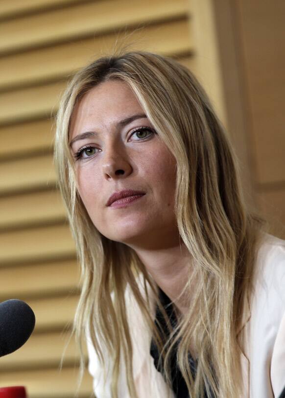 Russia's Maria Sharapova listens to a reporter during a press conference for the 2013 French Open tennis tournament, at Roland Garros stadium in Paris.