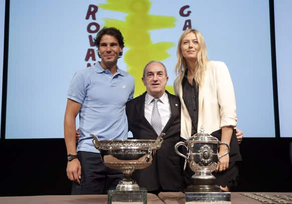 Spain's Rafael Nadal, Head of the French Tennis Federation, Jean Gachassin and Russia's Maria Sharapova pose during the draw for the 2013 French Open tennis tournament, at Roland Garros stadium in Paris.