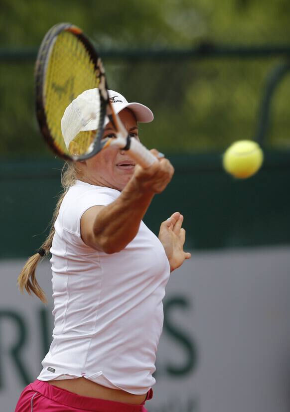 Kazakhstan's Yulia Putintseva returns the ball to Japan's Ayumi Morita during their first round match of the French Open tennis tournament at the Roland Garros stadium in Paris.