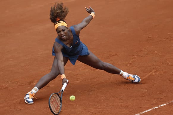 Serena Williams of the US returns against Georgia's Anna Tatishvili in their first round match of the French Open tennis tournament, at Roland Garros stadium in Paris.