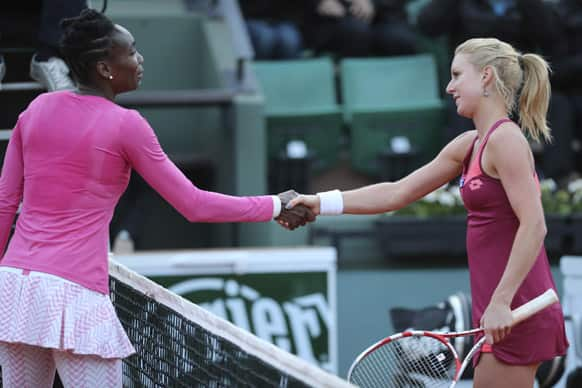 Venus Williams of the US, congratulates Poland's Urszula Radwanska with her first round match win of the French Open tennis tournament, at Roland Garros stadium in Paris.