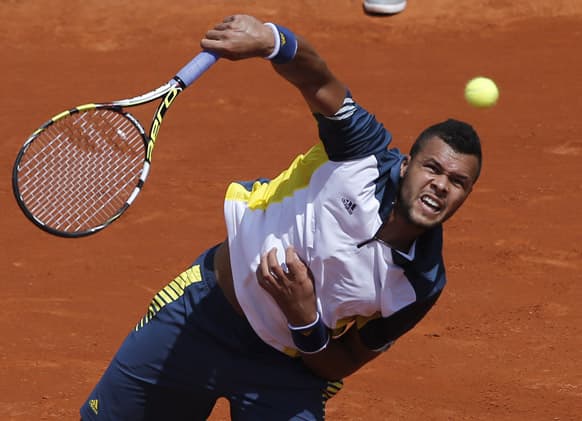 France's Jo-Wilfried Tsonga serves the ball to Slovenia's Aljaz Bedene during their first round match of the French Open tennis tournament at the Roland Garros stadium in Paris. Tsonga won 6-2, 6-2, 6-3.