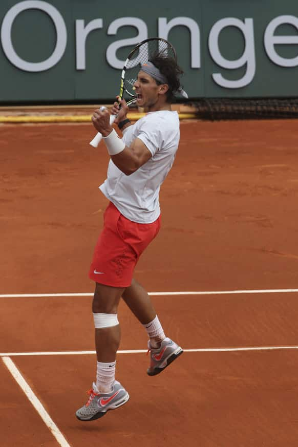 Spain's Rafael Nadal celebrates defeating Germany's Daniel Brands in their first round match of the French Open tennis tournament, at Roland Garros stadium in Paris. Nadal won in four sets 4-6, 7-6, 6-4, 6-3.