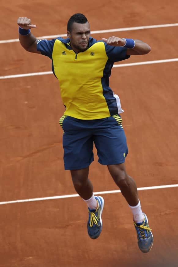 France's Jo-Wilfried Tsonga celebrates winning against Finland's Jarkko Nieminen in their second round match of the French Open tennis tournament, at Roland Garros stadium in Paris.