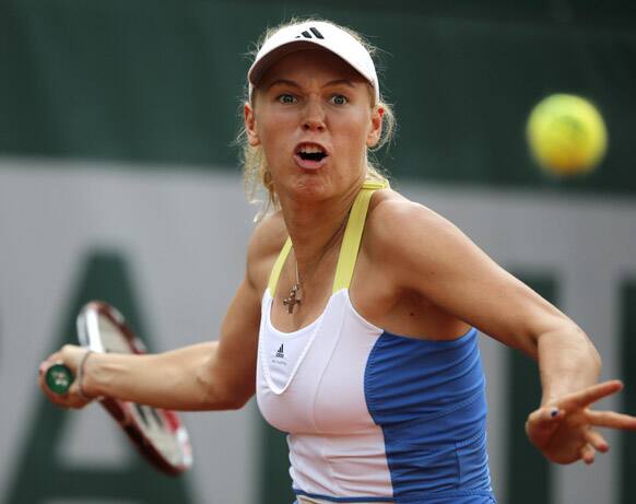 Denmark's Caroline Wozniacki returns the ball to Serbia's Bojana Jovanovski during their second round match of the French Open tennis tournament at the Roland Garros stadium.