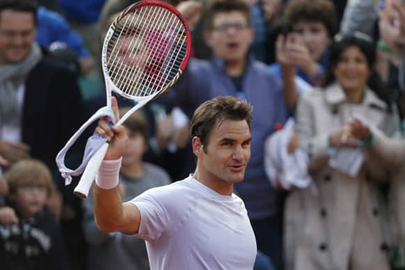 Switzerland's Roger Federer greets spectators after defeating India's Somdev Devvarman in their second round match of the French Open tennis tournament, at Roland Garros stadium in Paris.