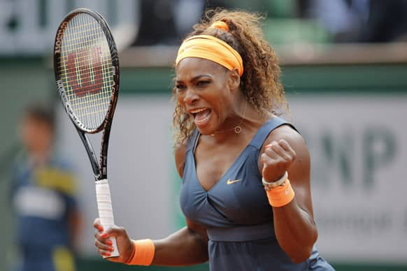 Serena Williams of the US celebrates scoring a point against Caroline Garcia of France in their second round match of the French Open tennis tournament, at Roland Garros stadium in Paris.