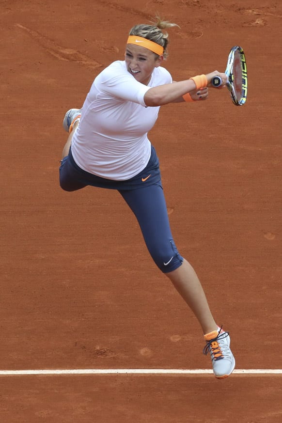 Victoria Azarenka of Belarus returns against Germany's Annika Beck in their second round match at the French Open tennis tournament, at Roland Garros stadium in Paris.