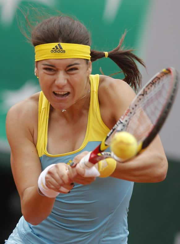 Sorana Cirstea of Romania returns against Serena Williams of the US in their third round match at the French Open tennis tournament, at Roland Garros stadium in Paris.