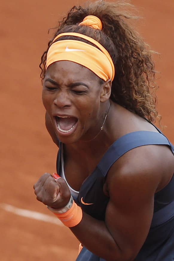 Serena Williams of the US celebrates scoring a point against Sorana Cirstea of Romania in their third round match at the French Open tennis tournament, at Roland Garros stadium in Paris. Williams won in two sets 6-0, 6-2.