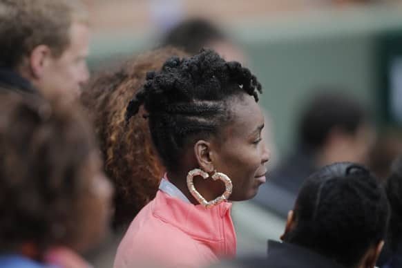 Venus Williams of the US watches her sister Serena's third round match against Sorana Cirstea of Romania at the French Open tennis tournament, at Roland Garros stadium in Paris.