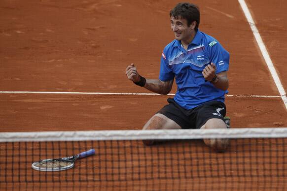 Tommy Robredo of Spain celebrates defeating Gael Monfils of France in their third round match at the French Open tennis tournament, at Roland Garros stadium in Paris. Robredo won in five sets 2-6, 6-7, 6-2, 7-6, 6-2.