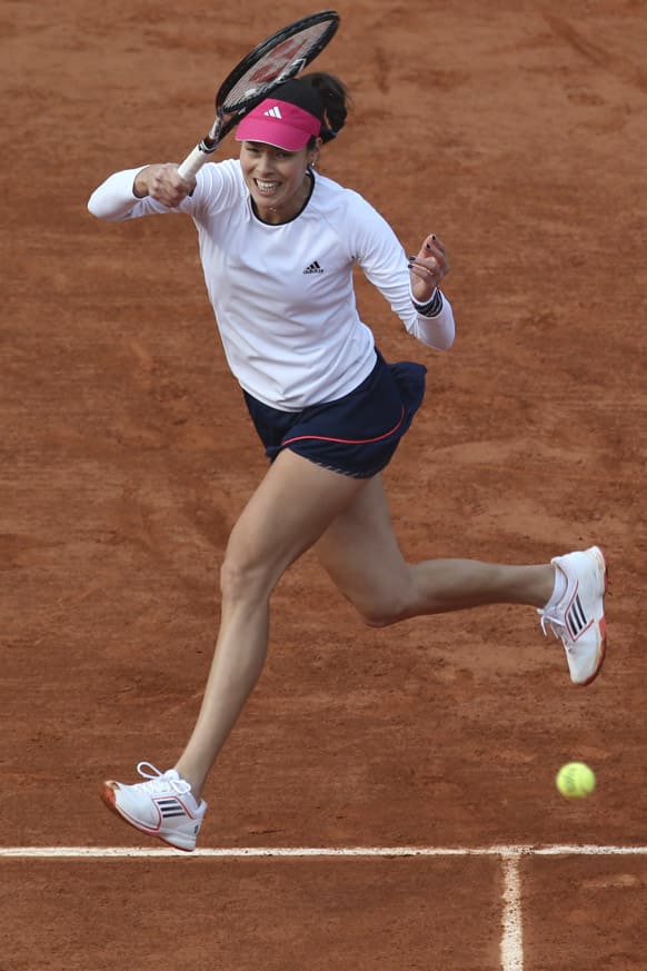 Serbia's Ana Ivanovic returns against Virginie Razzano of France in their third round match at the French Open tennis tournament, at Roland Garros stadium in Paris.