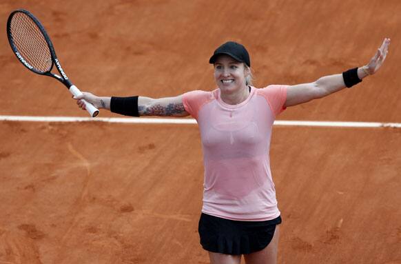 Bethanie Mattek-Sands, of the US, waves to the public after defeating Argentina's Paula Ormaechea during their third round match of the French Open tennis tournament at the Roland Garros stadium.