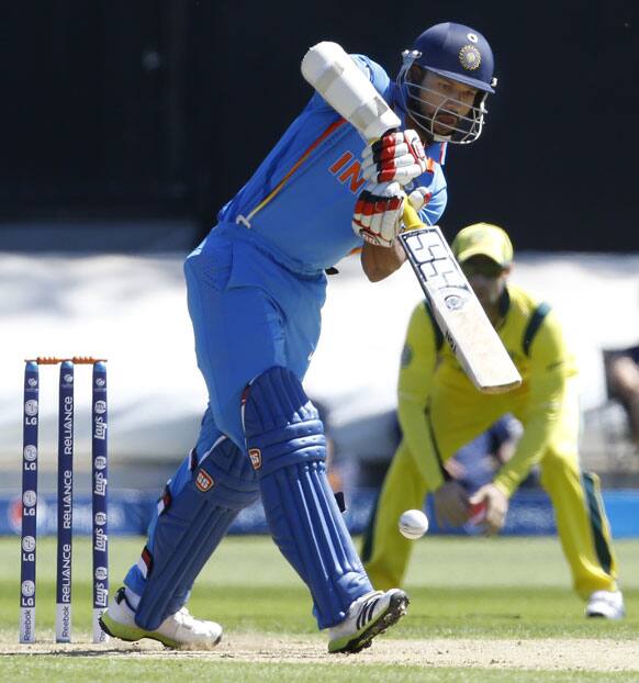 Shikhar Dhawan plays a shot off the bowling of Australia's Clint McKay during a warm up cricket match for the upcoming ICC Champions Trophy between India and Australia at the Cardiff Wales Stadium in Cardiff.