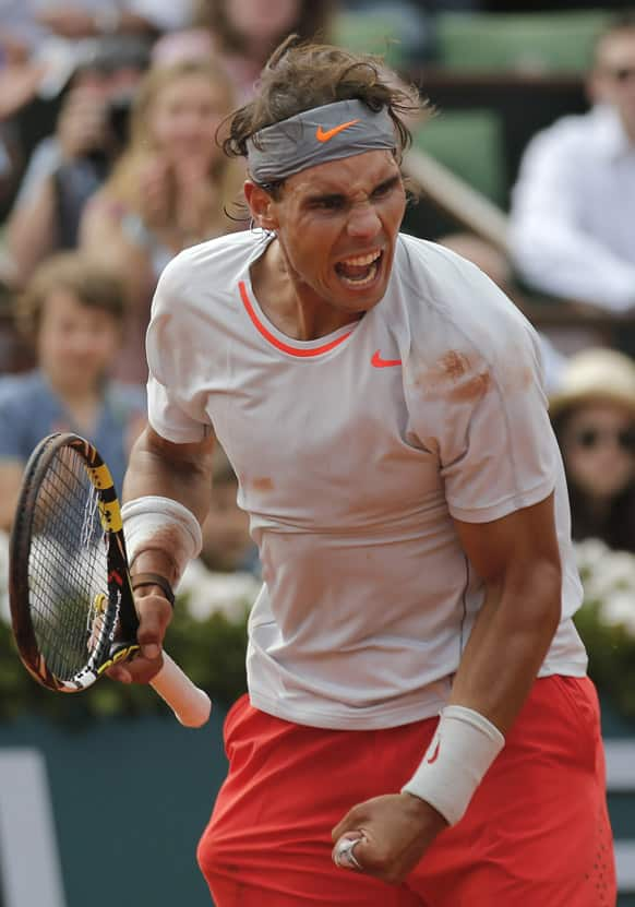 Spain's Rafael Nadal reacts after defeating Switzerland's Stanisas Wawrinka during their quarterfinal match of the French Open tennis tournament at the Roland Garros stadium in Paris. Nadal won 6-2, 6-3, 6-1.