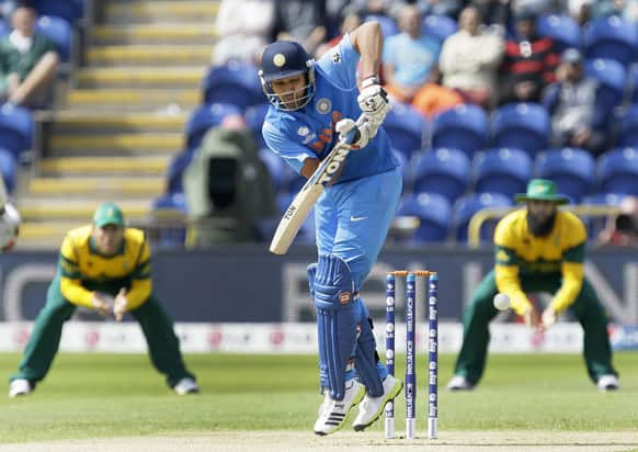 Rohit Sharma scores the first run against South Africa during their group stage ICC Champions Trophy cricket match in Cardiff, Wales.