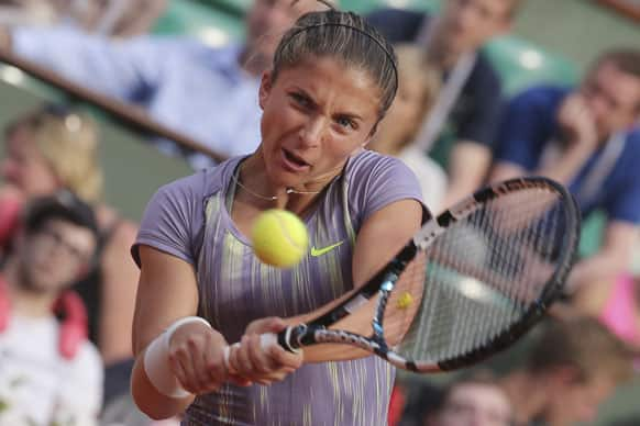 Italy's Sara Errani returns against Serena Williams of the US in their semifinal match at the French Open tennis tournament, at Roland Garros stadium in Paris.