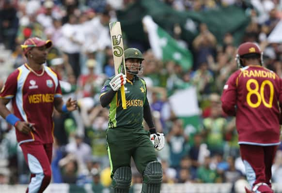 Pakistan's Nasir Jamshed reacts to his 50 runs against West Indies during their ICC Champions Trophy group B cricket match at the Oval cricket ground in London.