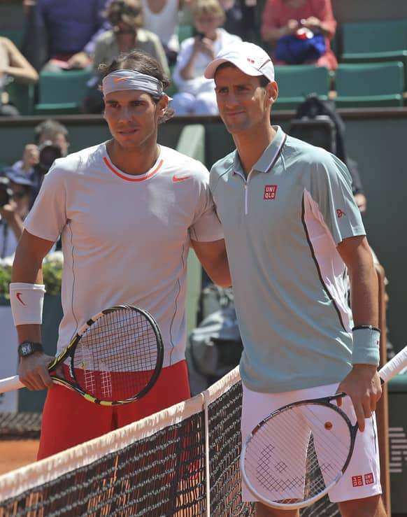 Spain's Rafael Nadal and Serbia's Novak Djokovic pose for photographers prior to their semifinal match at the French Open tennis tournament, at Roland Garros stadium in Paris.