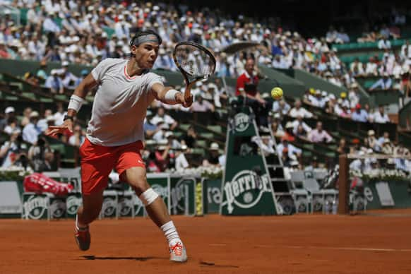 Spain's Rafael Nadal returns against Serbia's Novak Djokovic in their semifinal match at the French Open tennis tournament, at Roland Garros stadium in Paris.