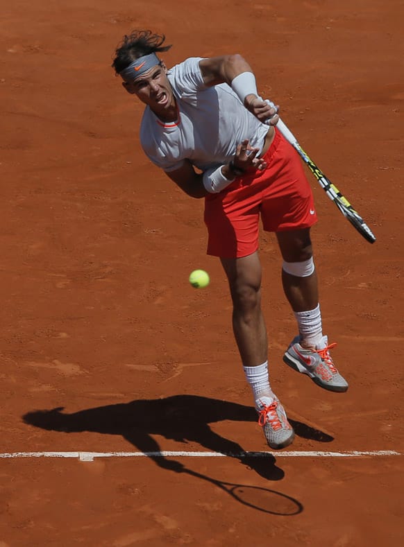 Spain's Rafael Nadal returns the ball to Serbia's Novak Djokovic during their semifinal match of the French Open tennis tournament at the Roland Garros stadium in Paris.