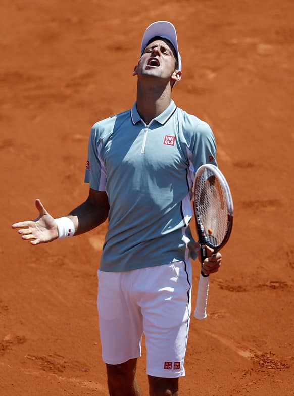 Serbia's Novak Djokovic reacts as he plays Spain's Rafael Nadal during their semifinal match of the French Open tennis tournament at the Roland Garros stadium in Paris.