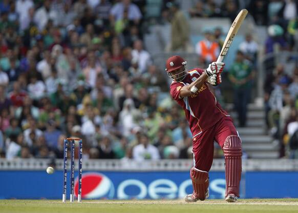 Kieron Pollard hits a four off the bowling of Pakistan's Wahab Riaz during their ICC Champions Trophy group B cricket match at the Oval cricket ground in London.