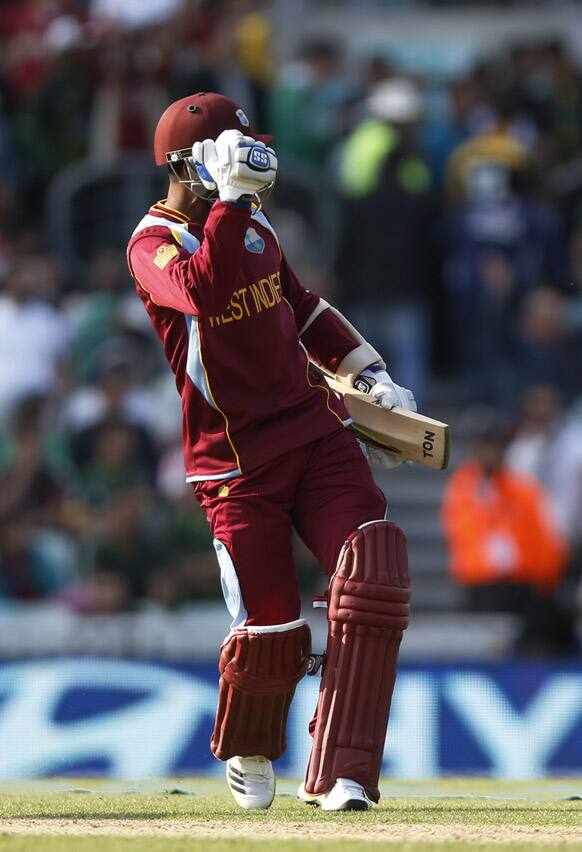 Denesh Ramdin celebrates their win against Pakistan at the end of their ICC Champions Trophy group B cricket match at the Oval cricket ground in London.