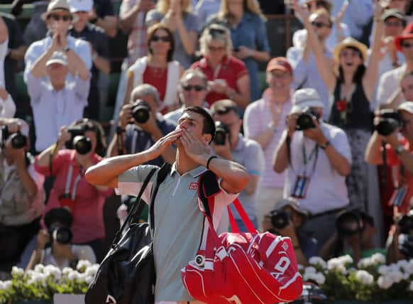 Serbia's Novak Djokovic blows a kiss to the public after losing to Spain's Rafael Nadal after their semifinal match of the French Open tennis tournament at the Roland Garros stadium in Paris.