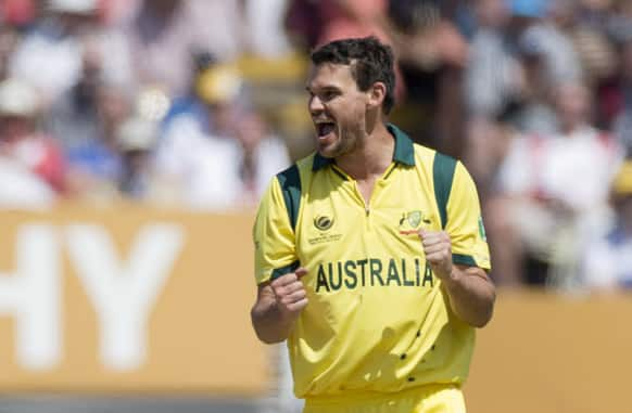 Australia's Clint McKay celebrates taking the wicket of England's Joe Root, not pictured, during the ICC Champions Trophy group A cricket match between England and Australia at Edgbaston cricket ground in Birmingham, England.