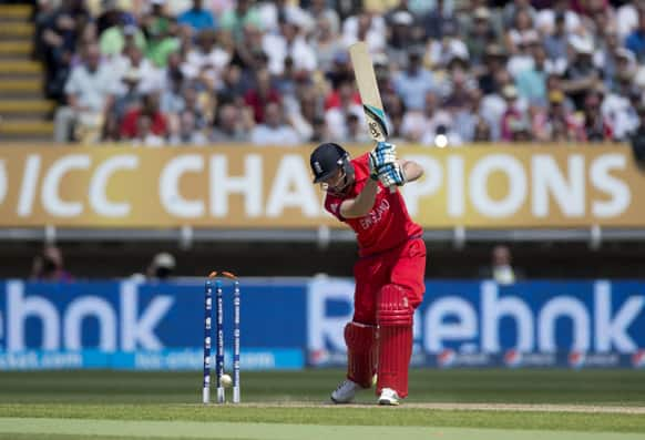 England's wicketkeeper Jos Buttler is bowled out by Australia's James Faulkner, not pictured, during the ICC Champions Trophy group A cricket match between England and Australia at Edgbaston cricket ground in Birmingham, England.