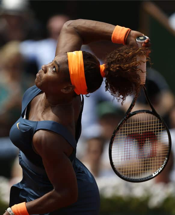 Serena Williams, of the US, serves the ball to Russia's Maria Sharapova during the Women's final match of the French Open tennis tournament at the Roland Garros stadium in Paris.