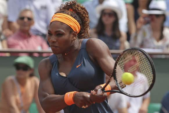 Serena Williams of the US returns against Russia's Maria Sharapova in the women's final of the French Open tennis tournament, at Roland Garros stadium in Paris.