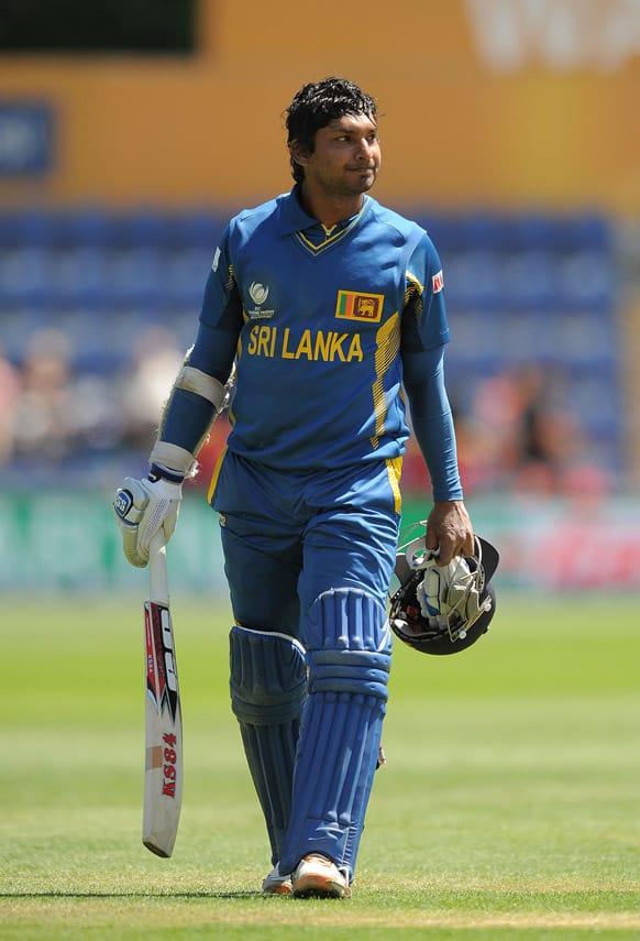 Sri Lanka's Kumar Sangakkara looks dejected as he leaves the field of play after losing his wicket during the ICC Champions Trophy match against New Zealand.