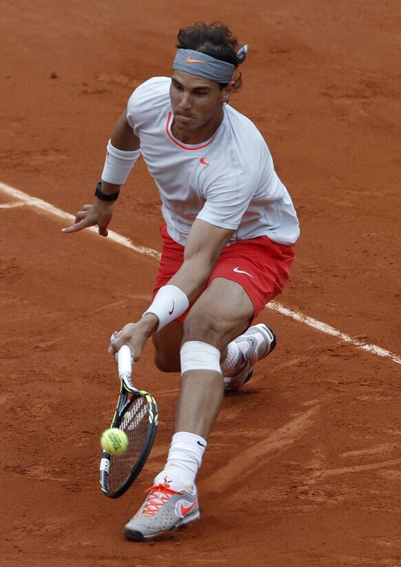 Spain's Rafael Nadal returns the ball to compatriot David Ferrer during the men's final match of the French Open tennis tournament at the Roland Garros stadium.