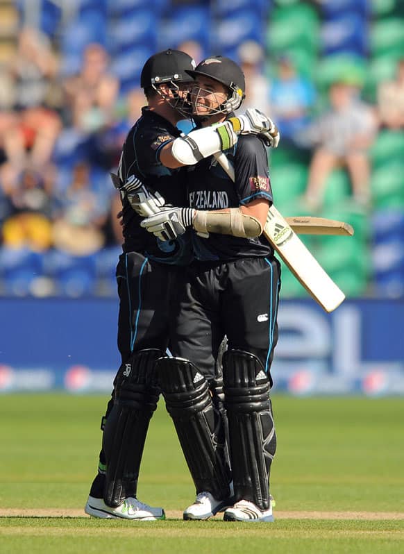 New Zealand's Mitchell McClenaghan, left, and team mate Tim Southee congratulate each other after they win the ICC Champions Trophy match at the SWALEC Stadium.