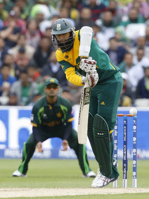 South Africa's Hashim Amla plays a shot off the bowling of Pakistan's Junaid Khan during an ICC Champions Trophy cricket match between Pakistan and South Africa at Edgbaston in Birmingham.