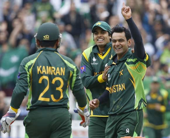 Pakistan's Mohammad Hafeez, right, celebrates taking the wicket of South Africa's Colin Ingram during an ICC Champions Trophy cricket match between Pakistan and South Africa at Edgbaston in Birmingham.