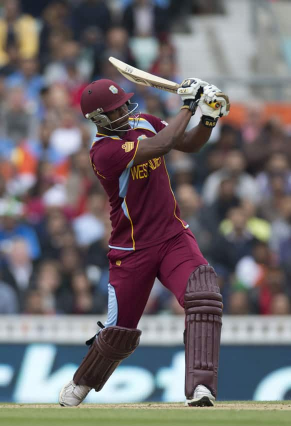 West Indies' Johnson Charles hits a shot during the ICC Champions Trophy group B cricket match between India and West Indies at The Oval cricket ground in London.