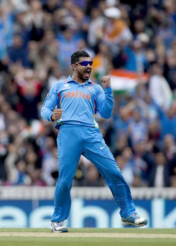 Ravindra Jadeja celebrates taking the wicket of West Indies' Johnson Charles, not pictured, during the ICC Champions Trophy group B cricket match between India and West Indies at The Oval cricket ground in London.