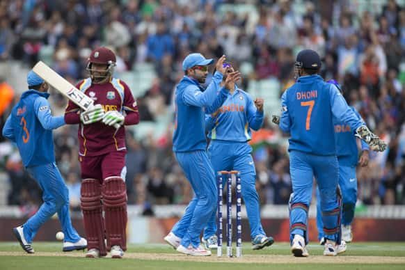 Ravindra Jadeja celebrates taking the wicket of West Indies' Ramnaresh Sarwan during the ICC Champions Trophy group B cricket match between India and West Indies at The Oval cricket ground in London.