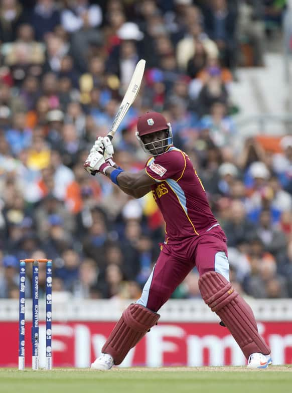 West Indies' Darren Sammy prepares to hit a shot during the ICC Champions Trophy group B cricket match between India and West Indies at The Oval cricket ground in London.