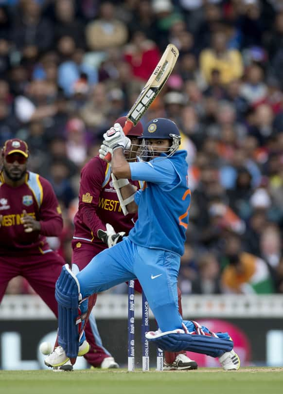 Shikhar Dhawan hits a shot during the ICC Champions Trophy group B cricket match between India and West Indies at The Oval cricket ground in London.