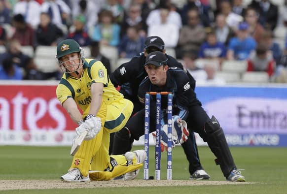 Australia's George Bailey hits a ball bowled by New Zealand's Daniel Vettori, unseen, during their group stage ICC Trophy cricket match at Edgbaston, Birmingham, England.