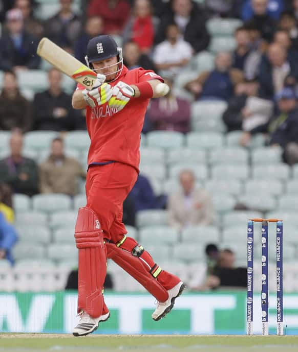 England's Ian Bell hits two runs off the bowling of Sri Lanka' Angelo Mathews during their ICC Champions Trophy cricket match at the Oval cricket ground in London.