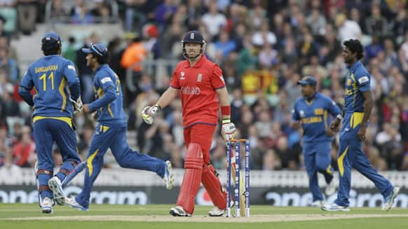 England's Ian Bell turns to walk off the pitch after being caught out by Sri Lanka' Tilakaratne Dilshan during their ICC Champions Trophy cricket match at the Oval cricket ground in London.